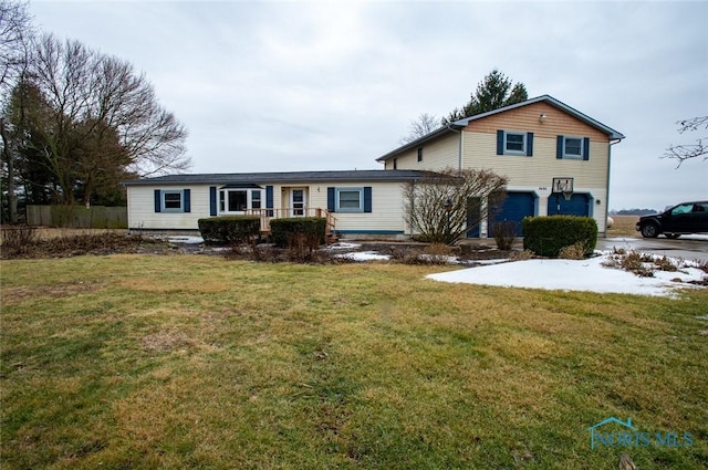 traditional-style home with a garage and a front yard