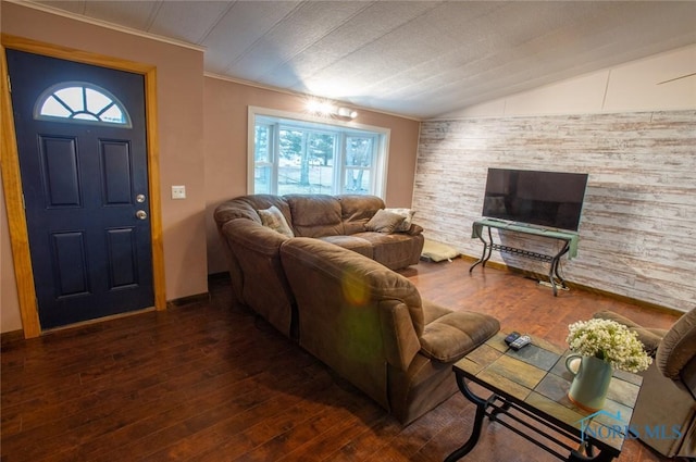 living area featuring ornamental molding, lofted ceiling, and hardwood / wood-style flooring