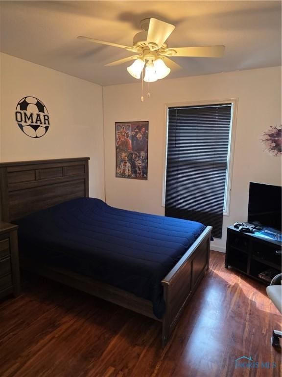 bedroom with ceiling fan and wood finished floors