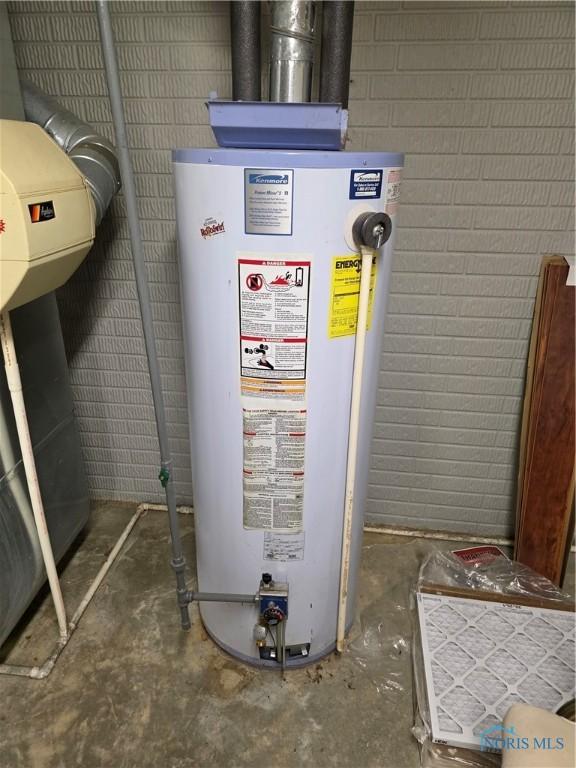 utility room featuring gas water heater