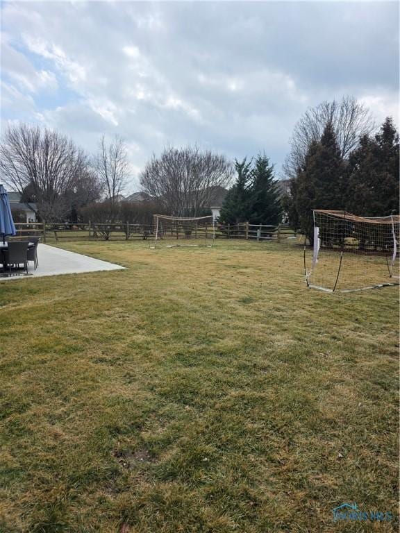 view of yard featuring a patio and fence