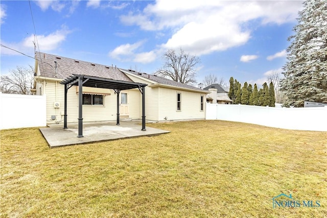 rear view of house featuring a lawn, a patio area, a fenced backyard, and a pergola