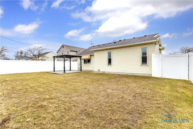 back of property with a patio area, a fenced backyard, a lawn, and a pergola