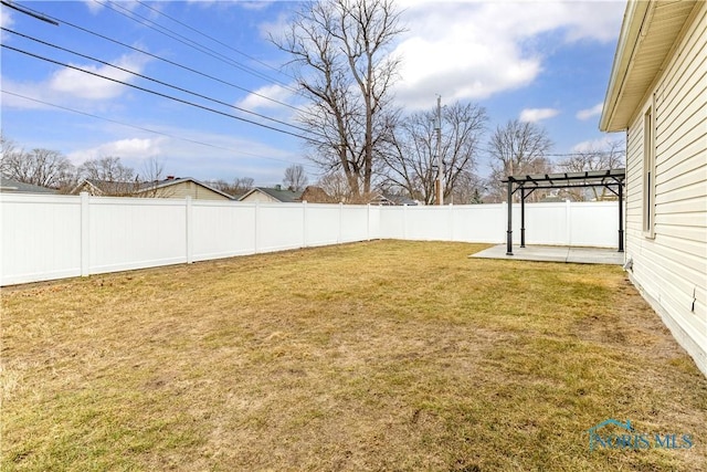 view of yard with a fenced backyard, a pergola, and a patio