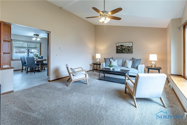 living room featuring a ceiling fan, light carpet, high vaulted ceiling, and baseboards