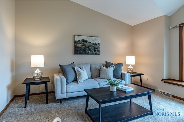 carpeted living room with visible vents, vaulted ceiling, and baseboards