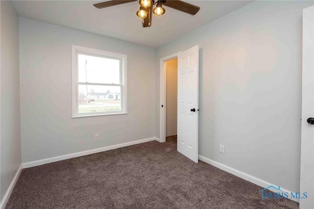 unfurnished bedroom featuring carpet floors, baseboards, and a ceiling fan