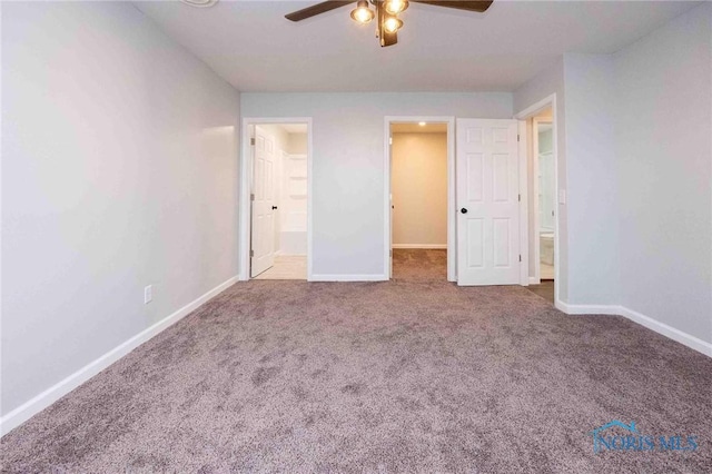 unfurnished bedroom with a ceiling fan, carpet, baseboards, and ensuite bathroom