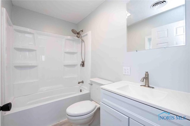 bathroom with visible vents, vanity, toilet, and tub / shower combination