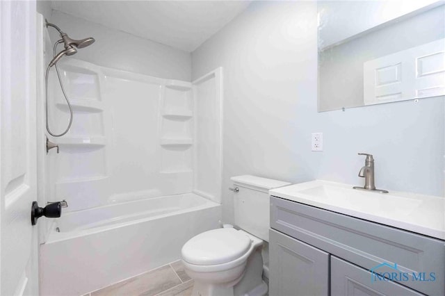 full bathroom with shower / washtub combination, vanity, and toilet