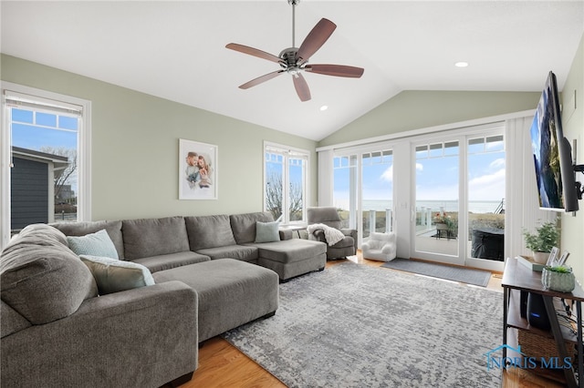 living area with lofted ceiling, recessed lighting, a ceiling fan, and light wood-style floors