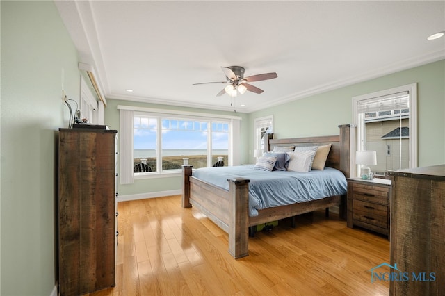 bedroom featuring recessed lighting, light wood-style flooring, ornamental molding, ceiling fan, and baseboards