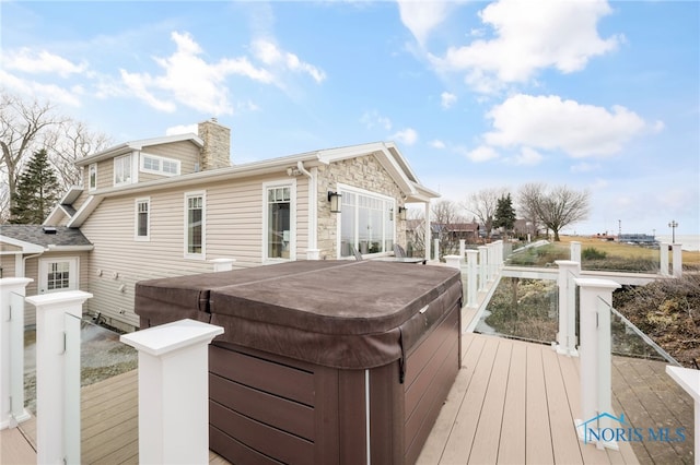 deck featuring a hot tub