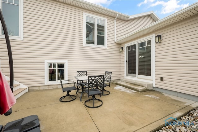 view of patio / terrace with entry steps and outdoor dining area