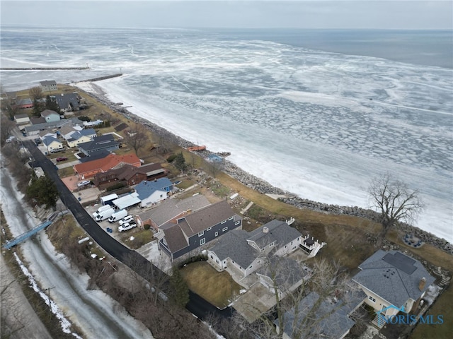 bird's eye view with a residential view and a water view