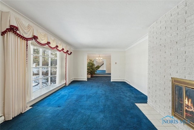 unfurnished living room with ornamental molding, baseboard heating, carpet floors, a fireplace, and a notable chandelier