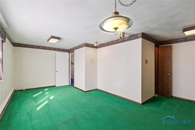 unfurnished room with ornamental molding, baseboard heating, carpet, and baseboards