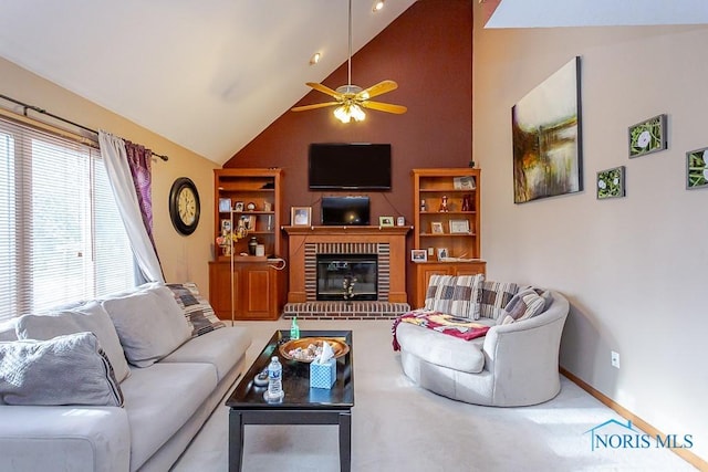 living area featuring high vaulted ceiling, carpet flooring, a ceiling fan, baseboards, and a brick fireplace