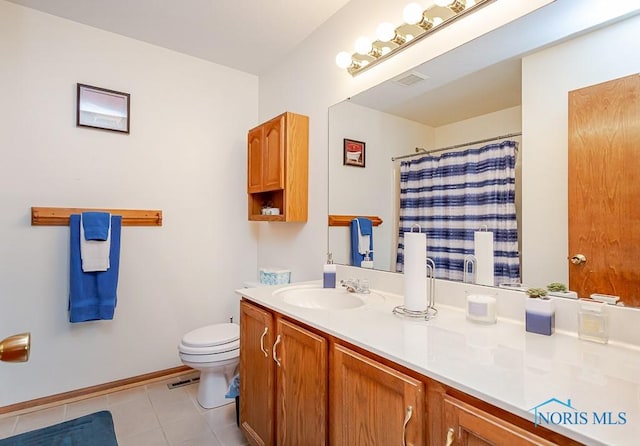 full bathroom with toilet, vanity, baseboards, visible vents, and tile patterned floors