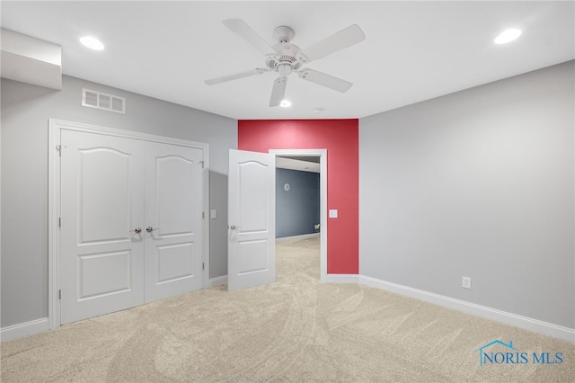 unfurnished bedroom featuring baseboards, visible vents, carpet, a closet, and recessed lighting