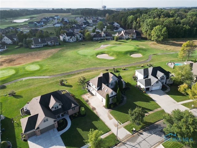 birds eye view of property featuring view of golf course and a residential view