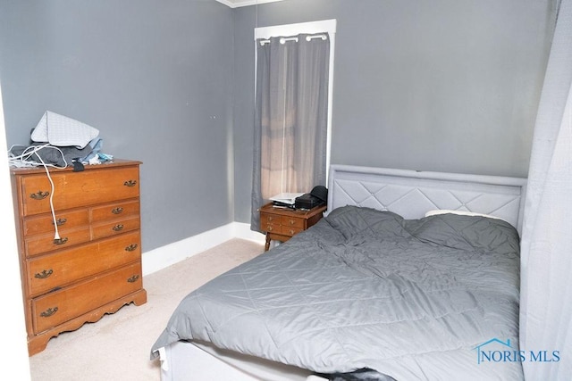 carpeted bedroom with baseboards