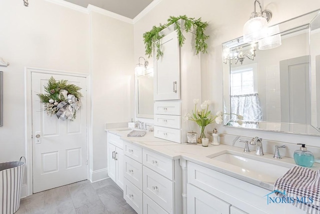 bathroom featuring double vanity, baseboards, ornamental molding, and a sink