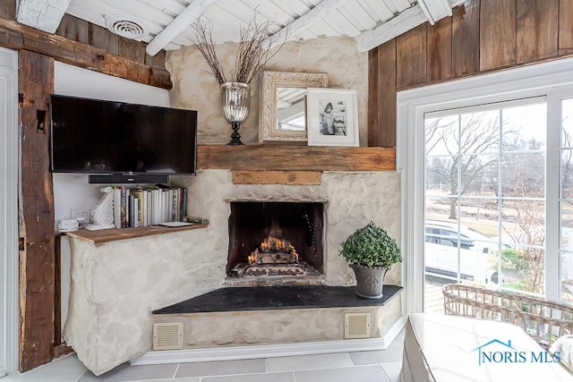 interior space featuring visible vents and a fireplace