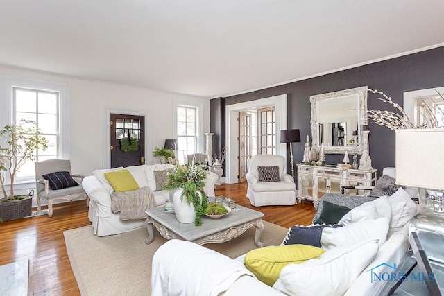 living area featuring plenty of natural light and wood finished floors