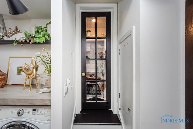 doorway to property featuring washer / clothes dryer