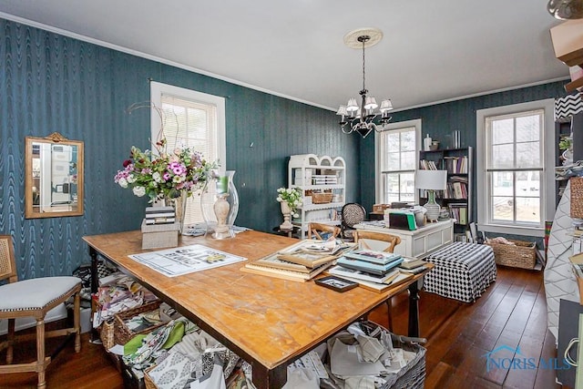 office area featuring dark wood-style floors, a notable chandelier, crown molding, and wallpapered walls