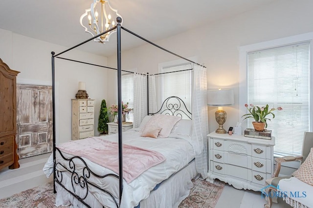 bedroom featuring a chandelier