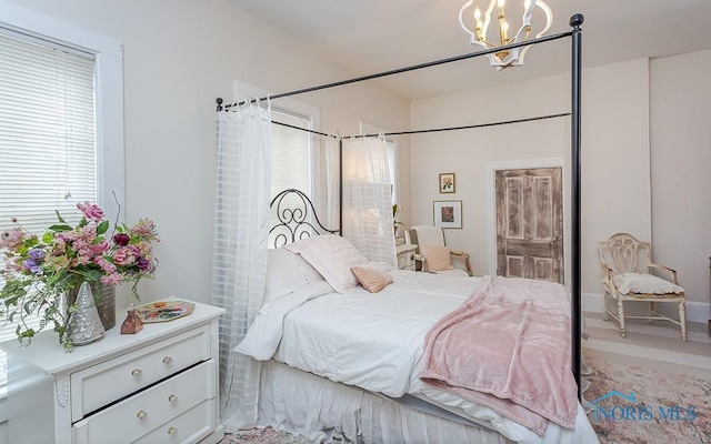 bedroom featuring an inviting chandelier