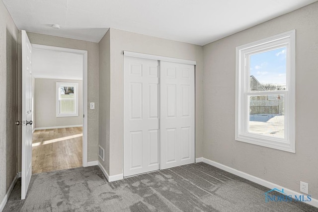 5728 Rudyard Rd, Sylvania, OH 43560 - unfurnished bedroom featuring a closet, visible vents, baseboards, and carpet floors