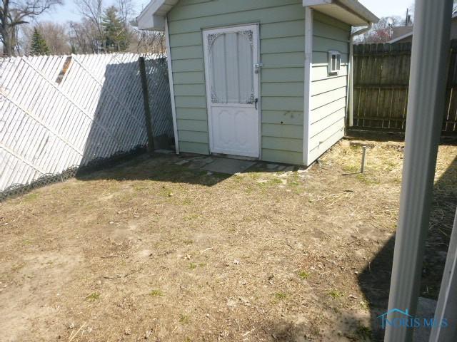 5728 Rudyard Rd, Sylvania, OH 43560 - view of shed with a fenced backyard