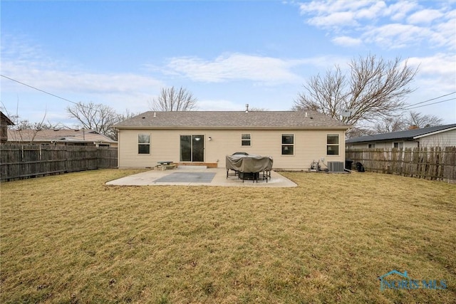 back of property with a patio area, a fenced backyard, a yard, and central AC unit