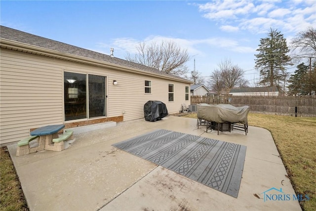 view of patio / terrace with fence, grilling area, central AC, and outdoor dining space