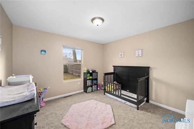 carpeted bedroom with baseboards