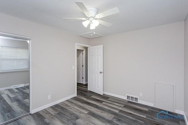 unfurnished bedroom with a ceiling fan, wood finished floors, visible vents, and baseboards