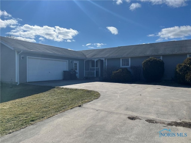 ranch-style home featuring driveway and an attached garage