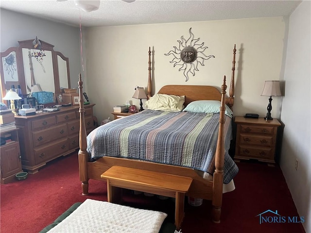 carpeted bedroom featuring a textured ceiling