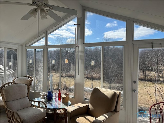 sunroom featuring lofted ceiling and ceiling fan