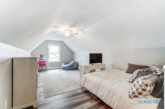 bedroom featuring lofted ceiling, a ceiling fan, and wood finished floors