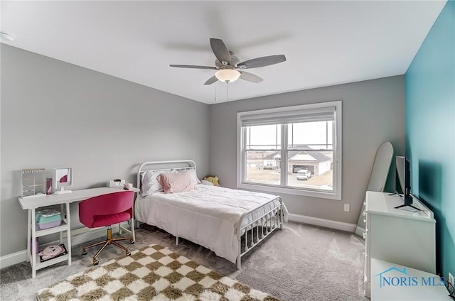 carpeted bedroom featuring ceiling fan and baseboards