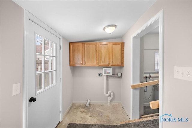 clothes washing area featuring baseboards, washer hookup, cabinet space, and hookup for an electric dryer