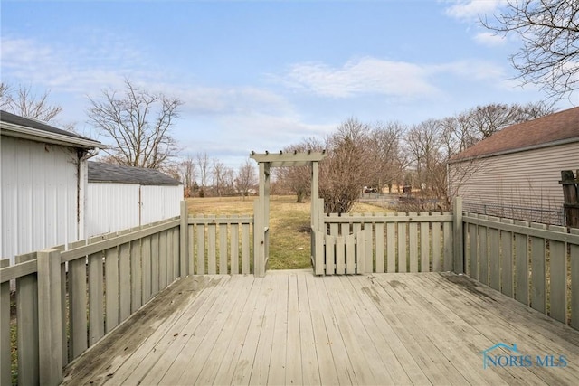 wooden deck with an outdoor structure