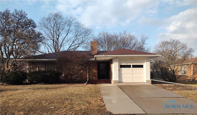 single story home featuring a chimney, stucco siding, concrete driveway, an attached garage, and a front lawn