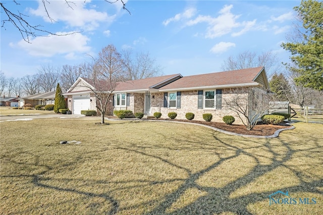 single story home featuring concrete driveway, an attached garage, fence, and a front yard