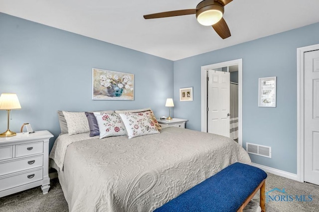 bedroom featuring ceiling fan, connected bathroom, carpet flooring, visible vents, and baseboards