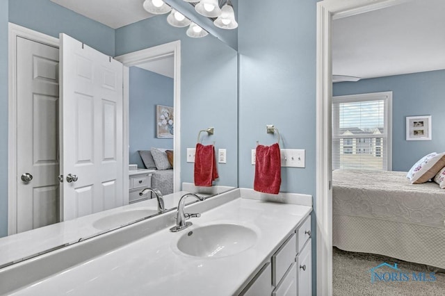 bathroom featuring ensuite bath and vanity